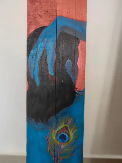 This painting of Krishna, titled "Turn Around," is part of my ongoing exploration of spiritual ideas. Created on reclaimed wood, it's less about religion and more about the philosophy of mindfulness and finding joy in the present moment. The piece uses the contrast of copper and blue to evoke a feeling of quiet contemplation.