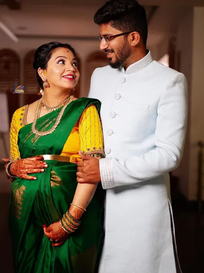 The loving gaze between a couple tells a beautiful story. This shot from a maternity ceremony highlights their partnership and shared happiness.