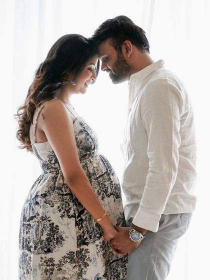 A timeless pose showing the couple's connection, with the beautiful toile-patterned dress adding a touch of classic elegance.