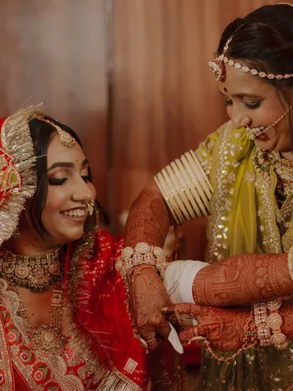 A precious moment between the bride and her mother, showcasing the beautiful side profile and hairstyle.