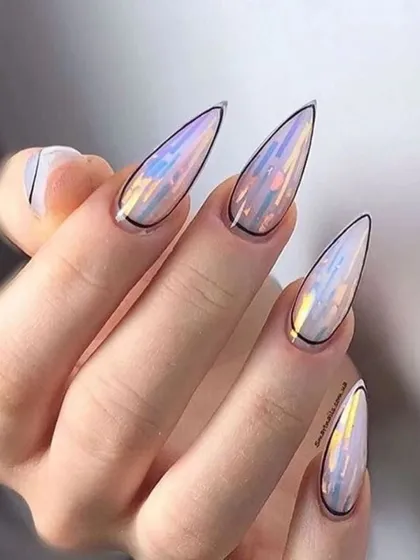 These long stiletto nails feature an iridescent, shattered glass effect with a fine black outline. The design catches the light beautifully, showing off a spectrum of colors.