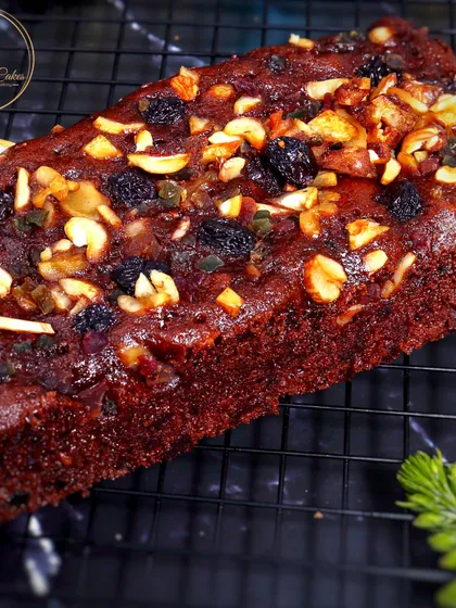 Another look at my signature Christmas plum loaf, showcasing the glossy, fruit-and-nut-studded top. Each loaf is baked to perfection to be moist and flavorful.