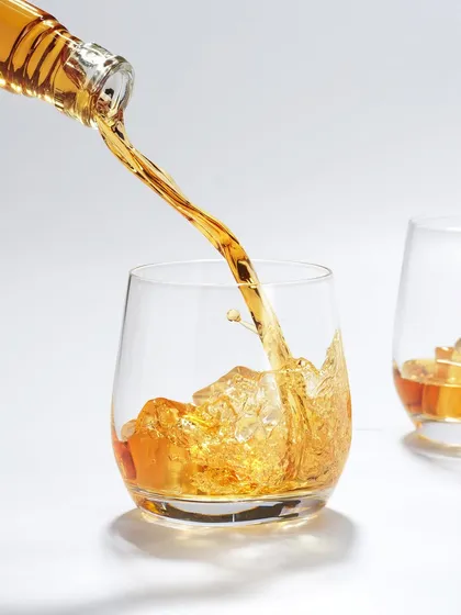 Capturing liquids in motion is like rolling the dice; you never know exactly what you'll get, and that's the magic. This shot freezes the perfect moment of a whiskey pour, capturing the energy of the splash and the beautiful amber color against a clean, high-key background. It’s a technical challenge that is always worth the chase.