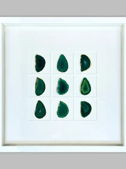 This striking piece features nine polished green agate stones arranged in a grid. The stones are floated on a clean white background within a deep shadow box, creating a modern, minimalist piece of natural art.