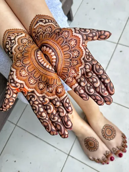 A gorgeous design combining the symmetry of a mandala with the elegance of traditional Indian patterns.