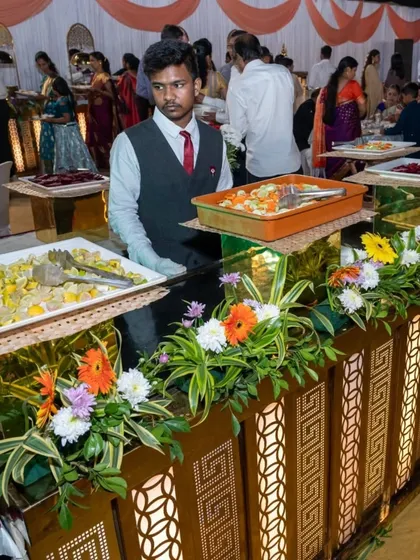 A closer look at a decorated salad bar within my royal buffet setup. I use fresh flowers and lighting to make even the salad counter look beautiful and inviting.