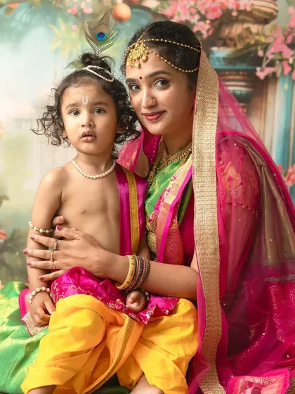 A close-up portrait showcasing the beautiful details of the costume and the sweet, innocent expression of a child dressed as Krishna for a Janmashtami session.