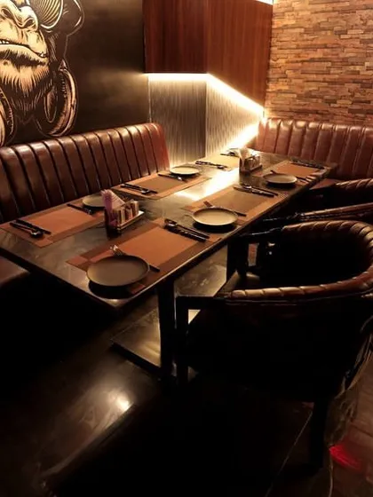 This seating nook at Harmony Inn demonstrates the use of subtle, integrated lighting to enhance the architectural details and create a comfortable, well-lit space for guests.