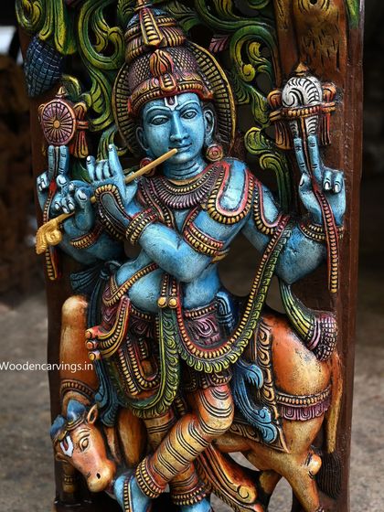 This 48-inch (4-foot) wall-mounted panel of Lord Krishna is a stunning example of Jali (lattice) work. The vibrant blue of the deity contrasts beautifully with the surrounding carvings, creating a piece that is both a sculpture and a work of art.