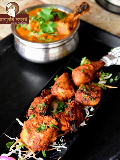 A close-up of our perfectly cooked chicken starters, garnished and ready to be served. A delicious preview of what to expect at your event.