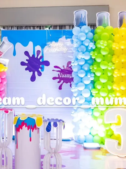 A vibrant and creative Art and Paint themed birthday party, with balloon columns designed to look like paint tubes and colorful splash details.