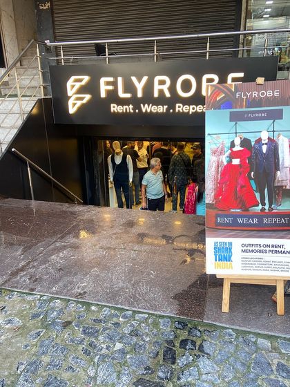 The entrance to our store, inviting you in to explore the world of rental fashion. You can see our "As seen on Shark Tank India" poster right at the front.