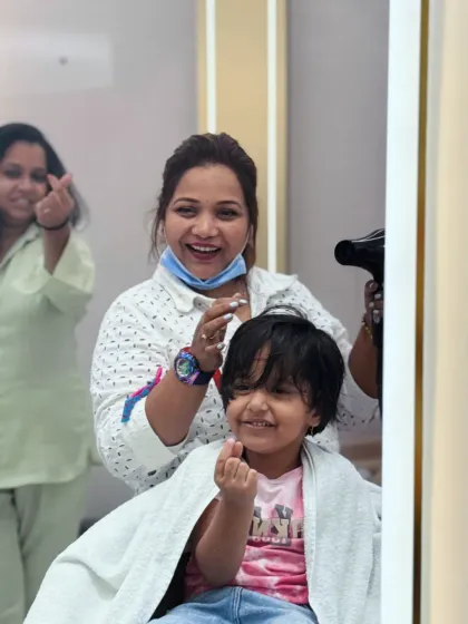 All smiles and hearts from our stylist and her cute client. We love making our salon a happy place for kids.