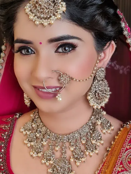 Look at that smile. This bride is radiating happiness with her glass finish makeup and stunning silver-toned jewelry.