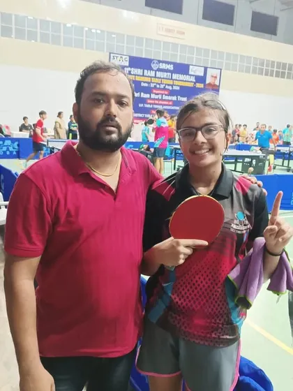 A victory pose from our U-15 Girls champion, Samriddhi Sharma, with her coach after a successful tournament in Bareilly.