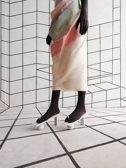 A detail of the custom footwear created for the Shanti Banaras campaign, designed to look like they are balancing on spheres.