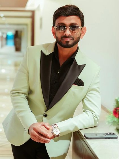 Another angle of the off-white tuxedo jacket, a staple in my event wardrobe. This look is both classic and contemporary, suitable for a wide range of corporate functions.