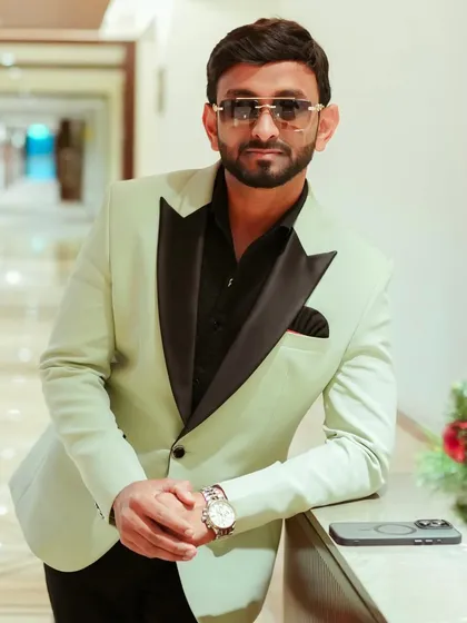A closer look at the details of my formal wear. A well-fitted suit and the right accessories are essential for any professional event host.