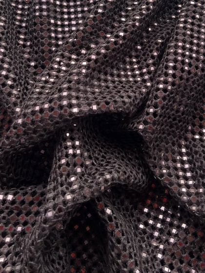 The same beloved cutwork fabric, shown here in a rich brown. The shimmering details add a touch of warmth and glamour.