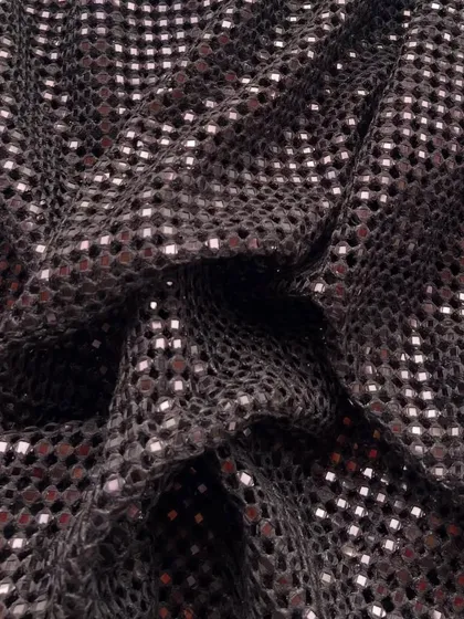 The same beloved cutwork fabric, shown here in a rich brown. The shimmering details add a touch of warmth and glamour.