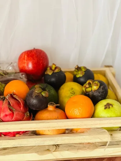 Sometimes, the best gift is one of health and wellness. I curate fresh fruit baskets featuring a vibrant selection of seasonal and exotic fruits like dragon fruit, mangosteen, and pomegranate in a rustic wooden crate.