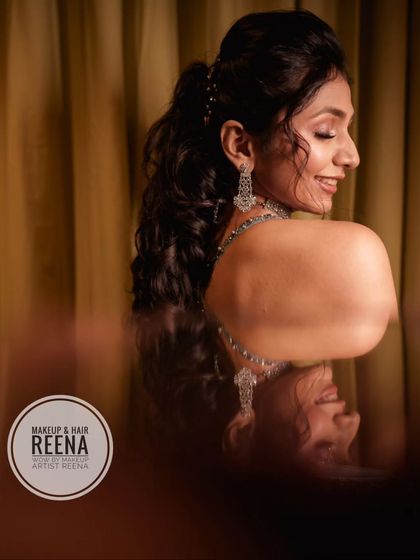 A creative shot of Aarjavi's sangeet look, showing her beautiful reflection. The ponytail hairstyle was perfect for a night of dancing.