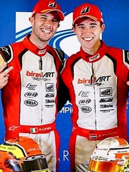 A celebratory pose from our World Champion and Vice World Champion, showcasing the pinnacle of karting achievement with Birel ART.