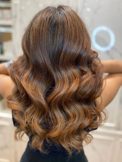 A close-up of the balayage, highlighting the intricate placement of colors and the healthy shine of the hair.