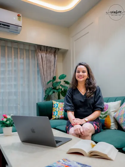 Here I am in one of our recently completed living rooms, a space designed to be both stylish and comfortable.