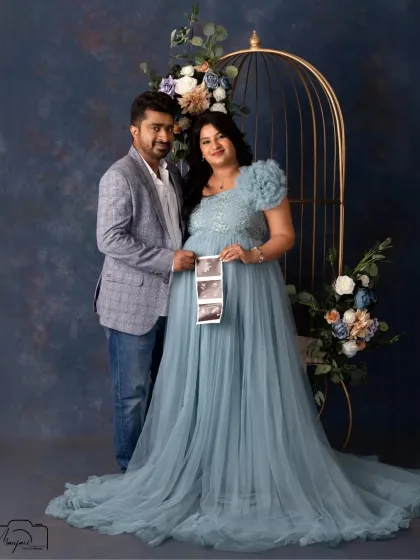 The first family photo. Holding up the sonogram pictures is a beautiful way to include the baby in the maternity shoot, and this couple does it with so much joy.