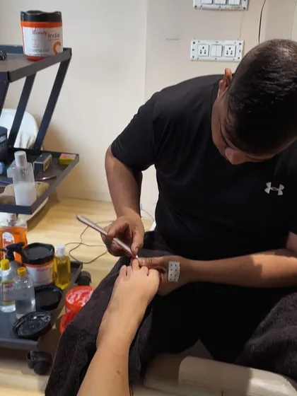 A glimpse into our spa pedicure service. Our technician provides detailed cuticle care and nail shaping for perfectly groomed feet.