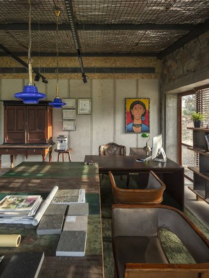 A view of our studio, featured in Architecture + Design. The space itself is a mood board of our philosophy, combining raw concrete, natural stone, and reclaimed wood with art and bespoke furniture to create an inspiring environment for our team.