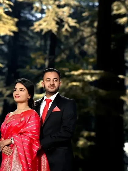 A close-up of the couple from their forest pre-wedding shoot. The focus here is on their connection, with the warm, golden-hour light filtering through the trees to create a dreamy, romantic mood.