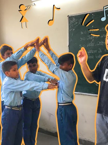 The "Alphabet Game" in action. Students work together to form letters with their bodies, a playful activity that teaches teamwork, creativity, and problem-solving.