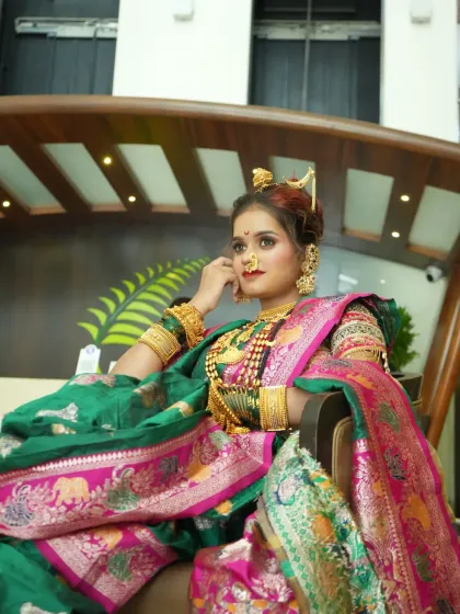 A regal pose showing the bride's confident posture and the luxurious fall of her saree.
