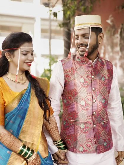 A happy, walking shot of the couple after their wedding rituals, ready to start their new journey.