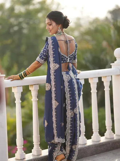 The final result is pure grace. This is a custom Vidhi look, where the drape is just as important as the makeup and hair to complete the bride's vision. Notice how the pallu is arranged to beautifully showcase the blouse and jewelry.