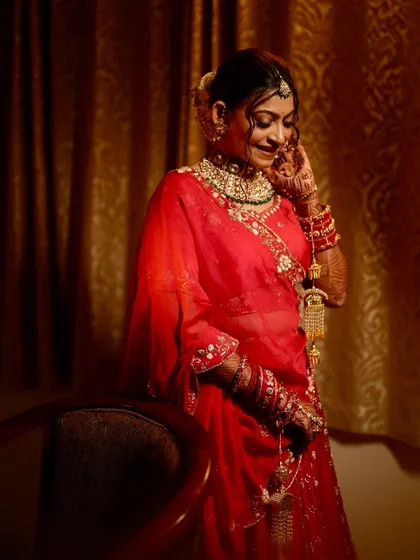 A candid and happy moment, with the bride looking down with a smile.