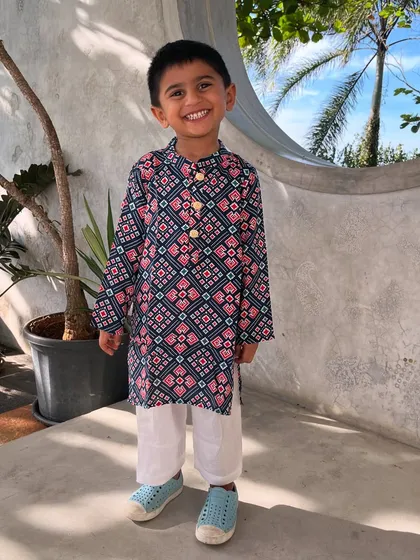 Who says ethnic wear for boys can't be fun? This Patola print kurta is one of my favorites. It’s crafted from breathable cotton, so your little man can run, jump, and play comfortably while looking incredibly dapper.