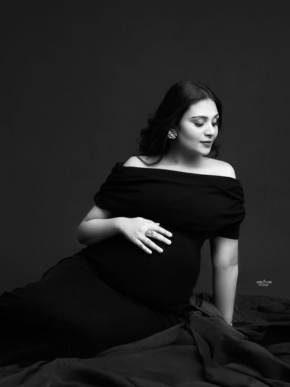 This black and white seated portrait is so full of grace. It's a quiet, beautiful moment captured in a timeless style.