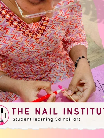 This student is learning 3D nail art, sculpting small, intricate designs that make the nails pop.