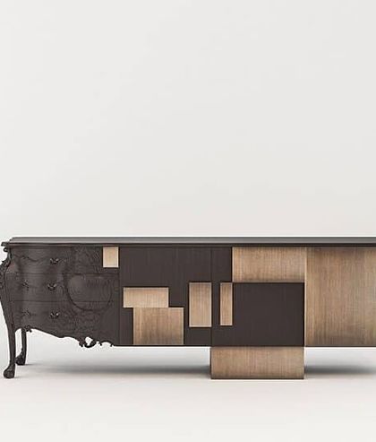The Abacus Sideboard shown in a different finish, demonstrating how the contrast between the dark carved wood and the lighter panels creates a visually striking effect.