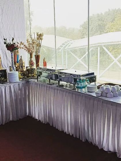 My team ready to serve at a corporate event for Big Concepts Foundation Pvt Ltd in Moti Bagh. I ensure my staff is prepared and professional, even for outdoor setups.