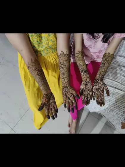 A lovely moment with a group of guests, all adorned with my intricate mehendi designs. Each person has a unique pattern, yet they look beautiful together.
