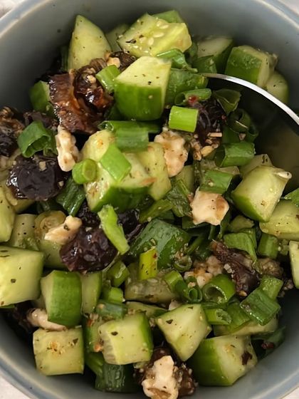 A refreshing cucumber salad with spring onions and walnuts. A simple and crunchy side dish.