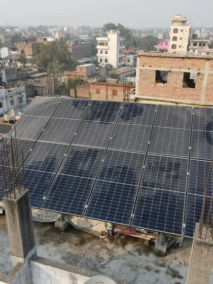The rooftop solar panel array at the school in Begusarai, Bihar. This system is designed to meet the daily energy demands of the entire school, making it self-sufficient and eco-friendly.