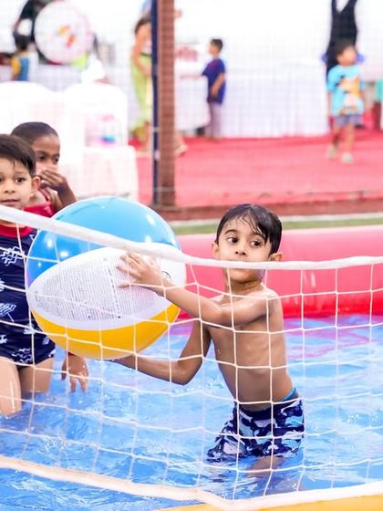 Kids enjoying a game of water volleyball. I provide all the necessary equipment for fun and friendly competition in the pool.