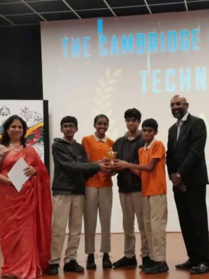 A team of our students from TCIS Cambridge International School receives an award for their 'Movebot' project. This line-following and manual control robot showcases their excellent teamwork and engineering skills.