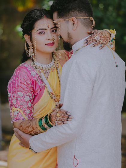 An intimate portrait with the bride looking over the groom's shoulder, her expression full of love and trust.