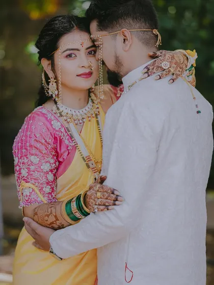 An intimate portrait with the bride looking over the groom's shoulder, her expression full of love and trust.